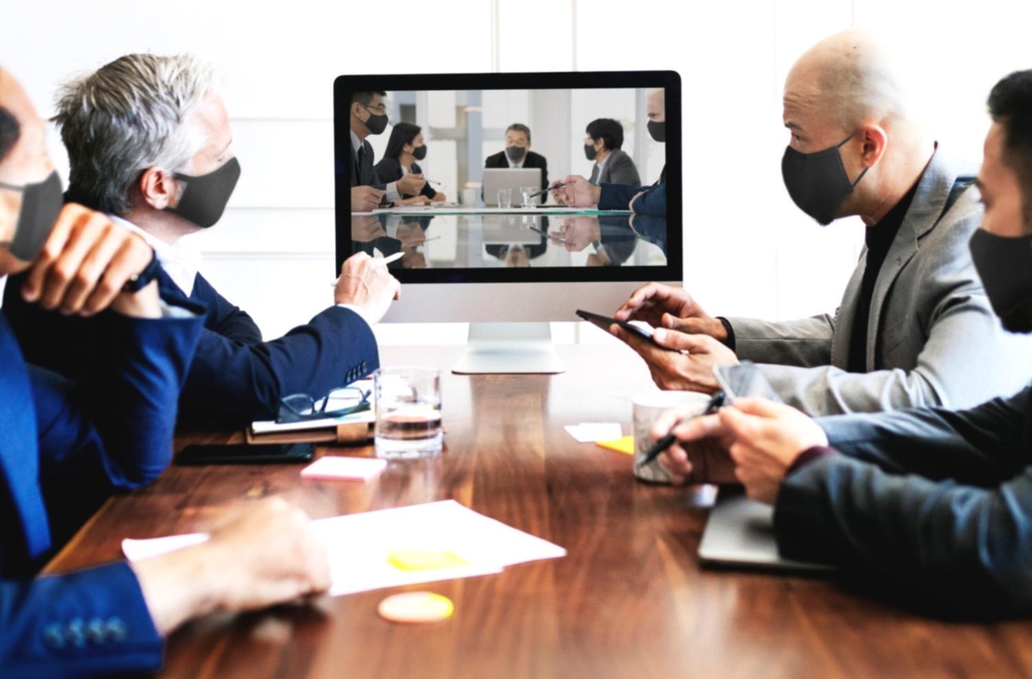 Investment professionals analyzing financial data on multiple screens during market analysis session